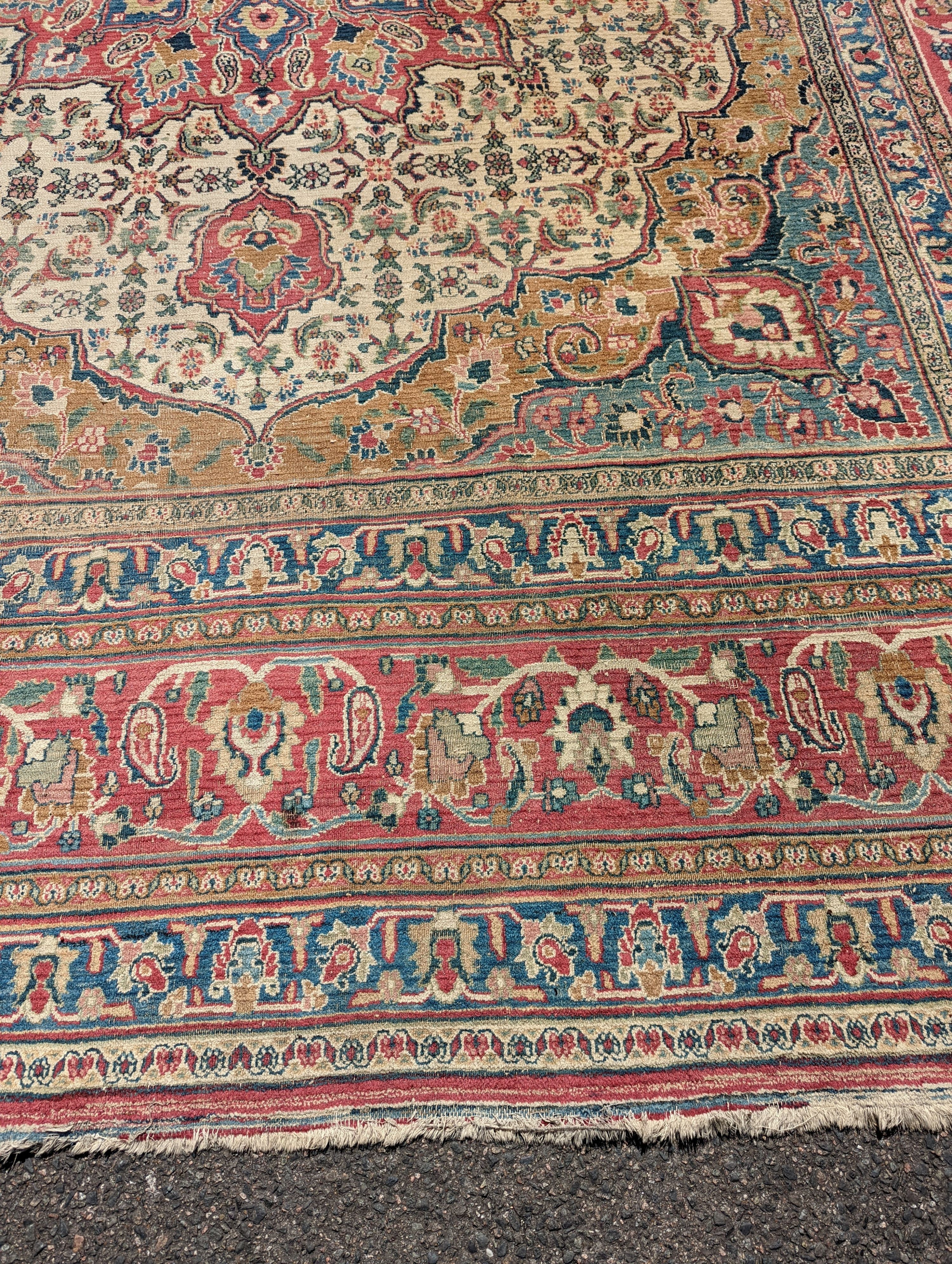 An Isfahan ivory ground carpet, 432 x 330cm